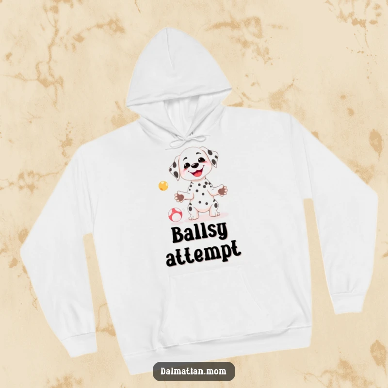 Funny Kawaii Dalmatian hoodie featuring a cute, petite dog with a goofy smile attempting to juggle, offering cozy humor.